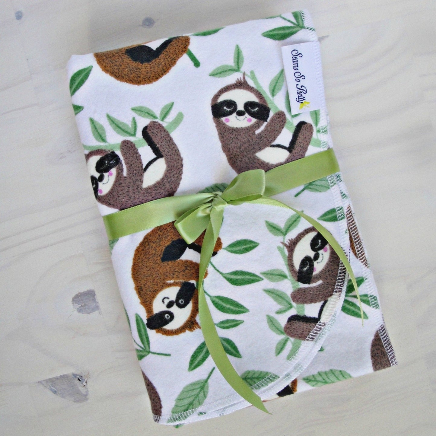 Sleepy Baby Sloths Flannel Blanket Packaged