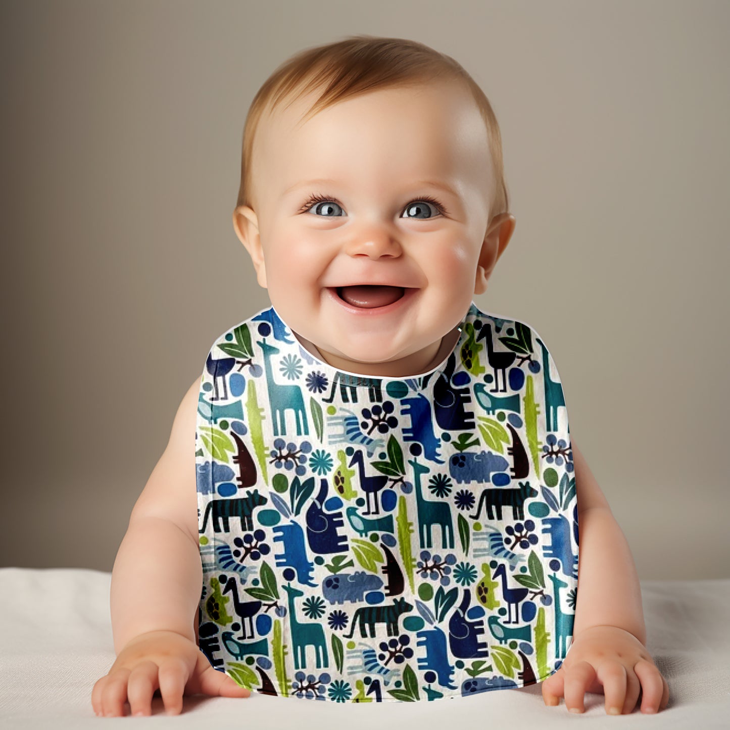 Smiling baby wearing zoo animals bib