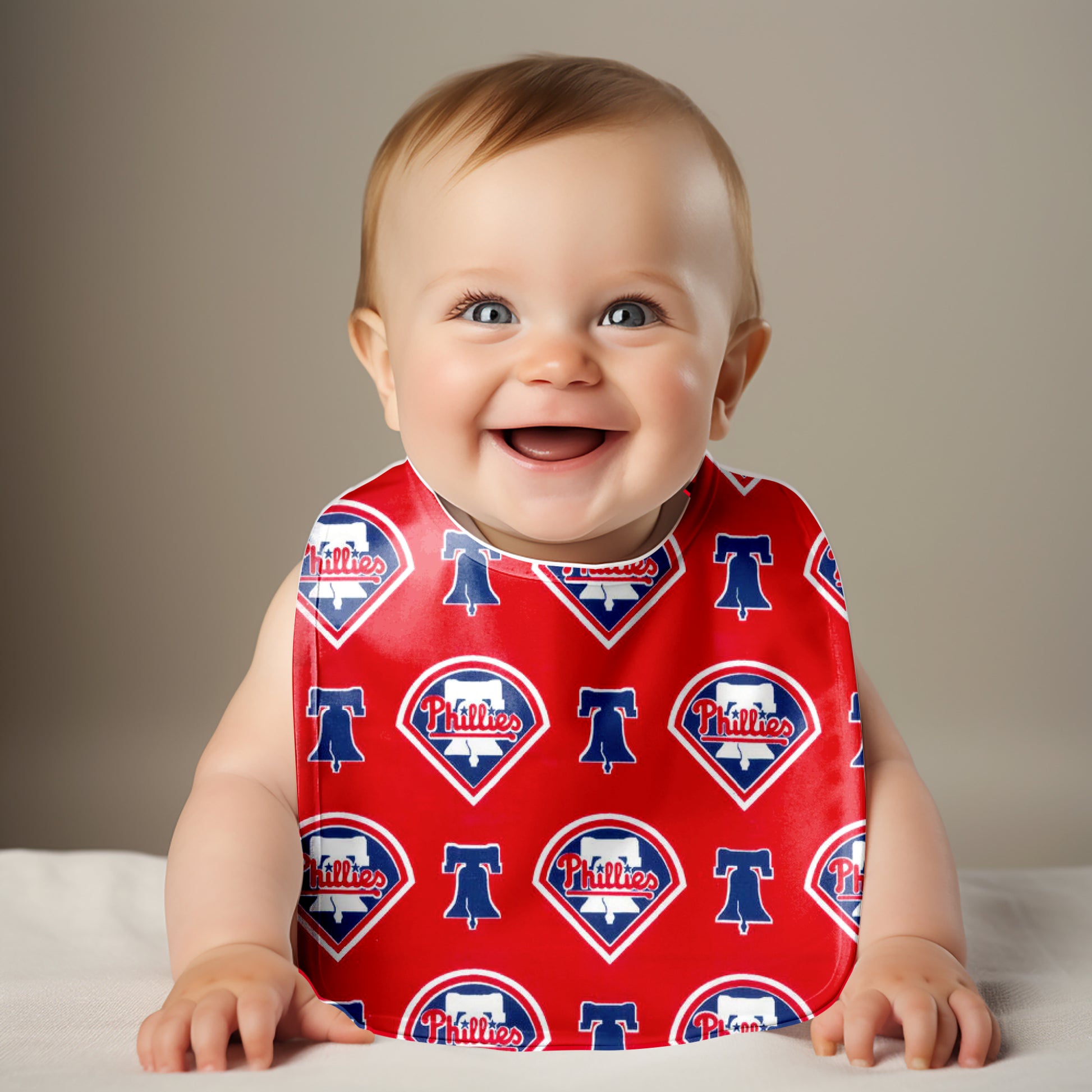 Smiling baby wearing Philadelphia Phillies Bib