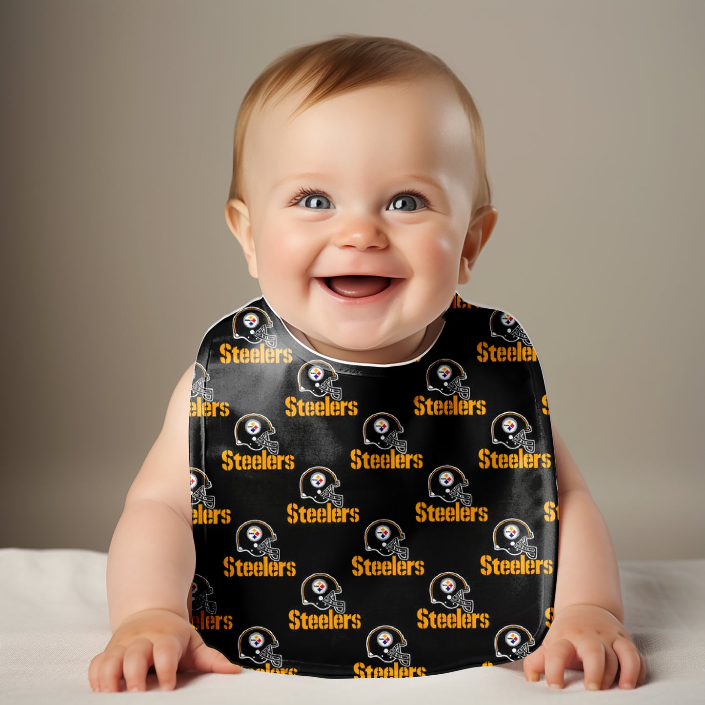 Smiling baby wearing Pittsburgh Steelers Bib
