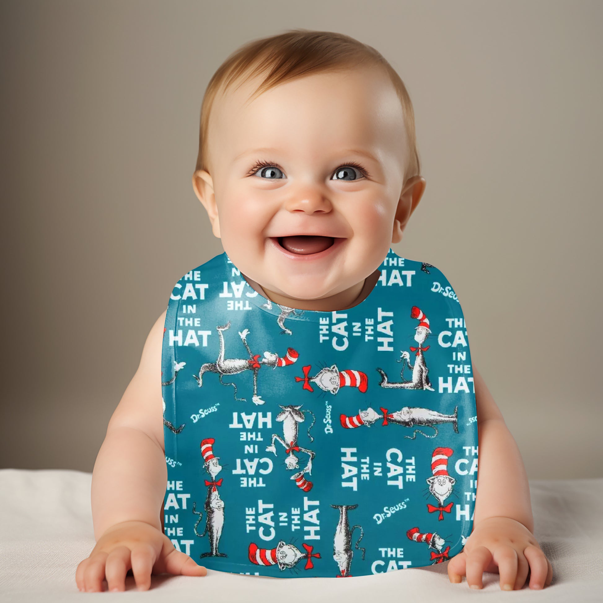 Smiling Baby wearing cat in the hat bib