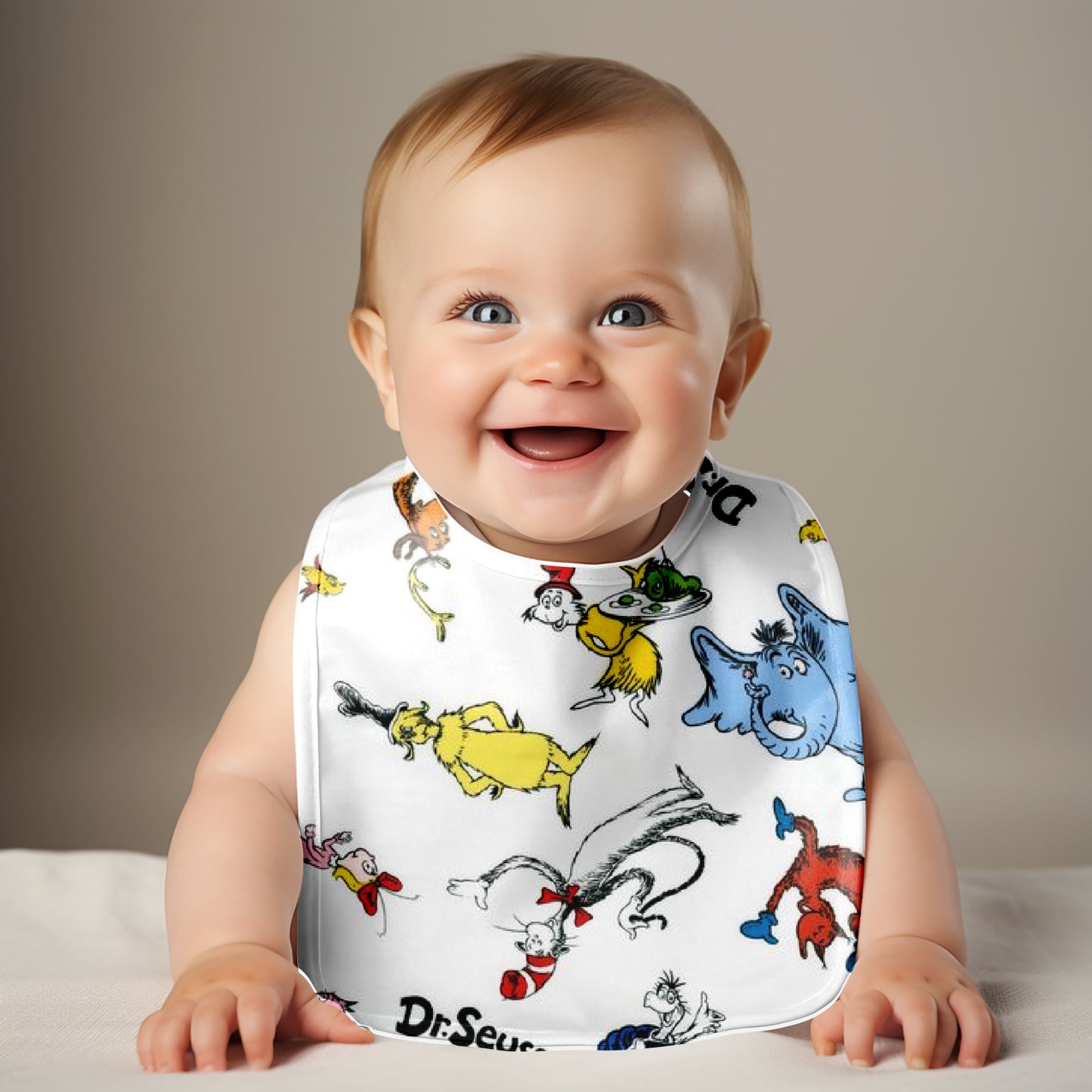 Smiling Baby wearing Dr Seuss Characters Bib