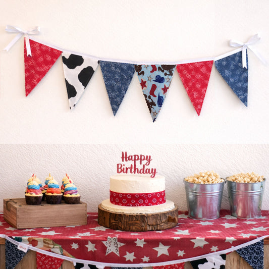 Western cowboy themed birthday party table with fabric bunting banner above cake and cupcakes large