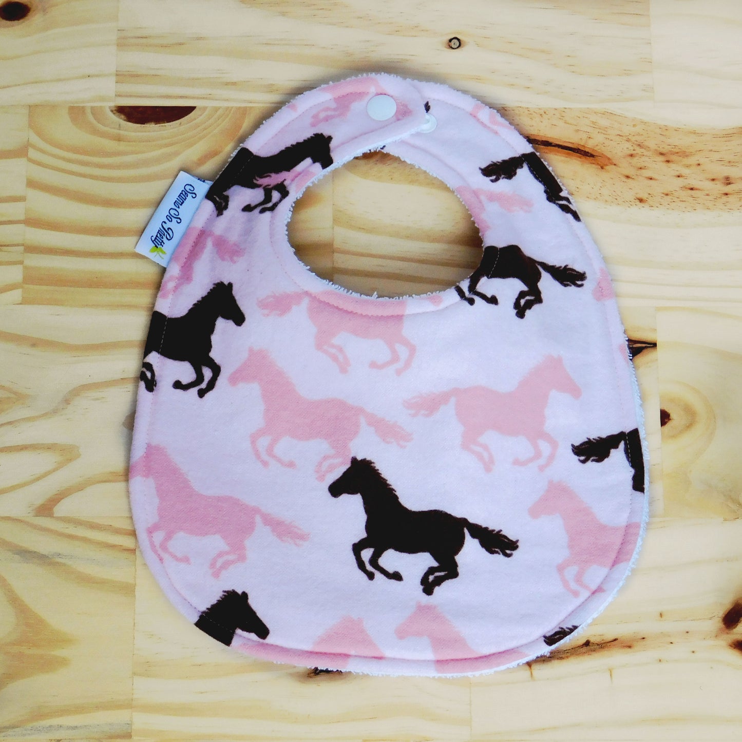 Galloping Brown and Pink Ponies Bib Front Snapped