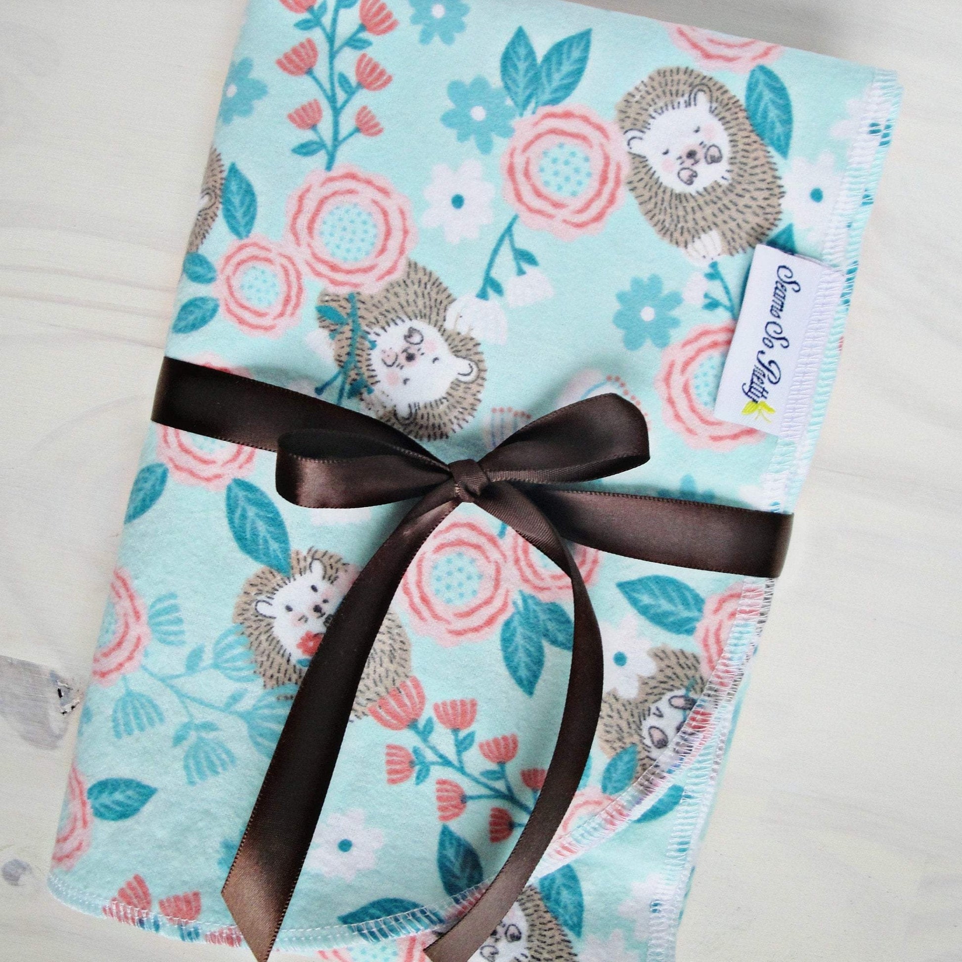Baby Hedgehog Floral Flannel Receiving Blanket wrapped in Brown Ribbbon