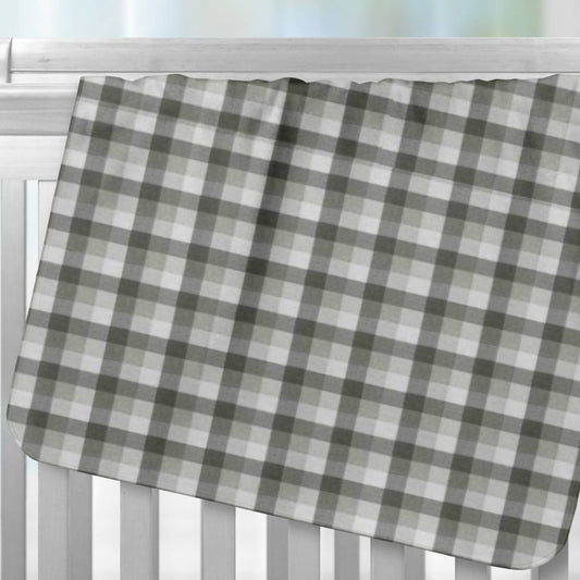 Gray and White Buffalo Check Flannel Blanket hanging over crib rail