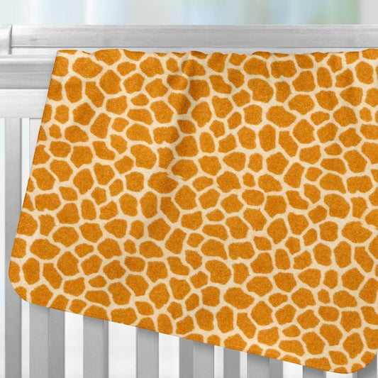 Jungle Giraffe Skin Flannel Receiving Blanket over crib rail