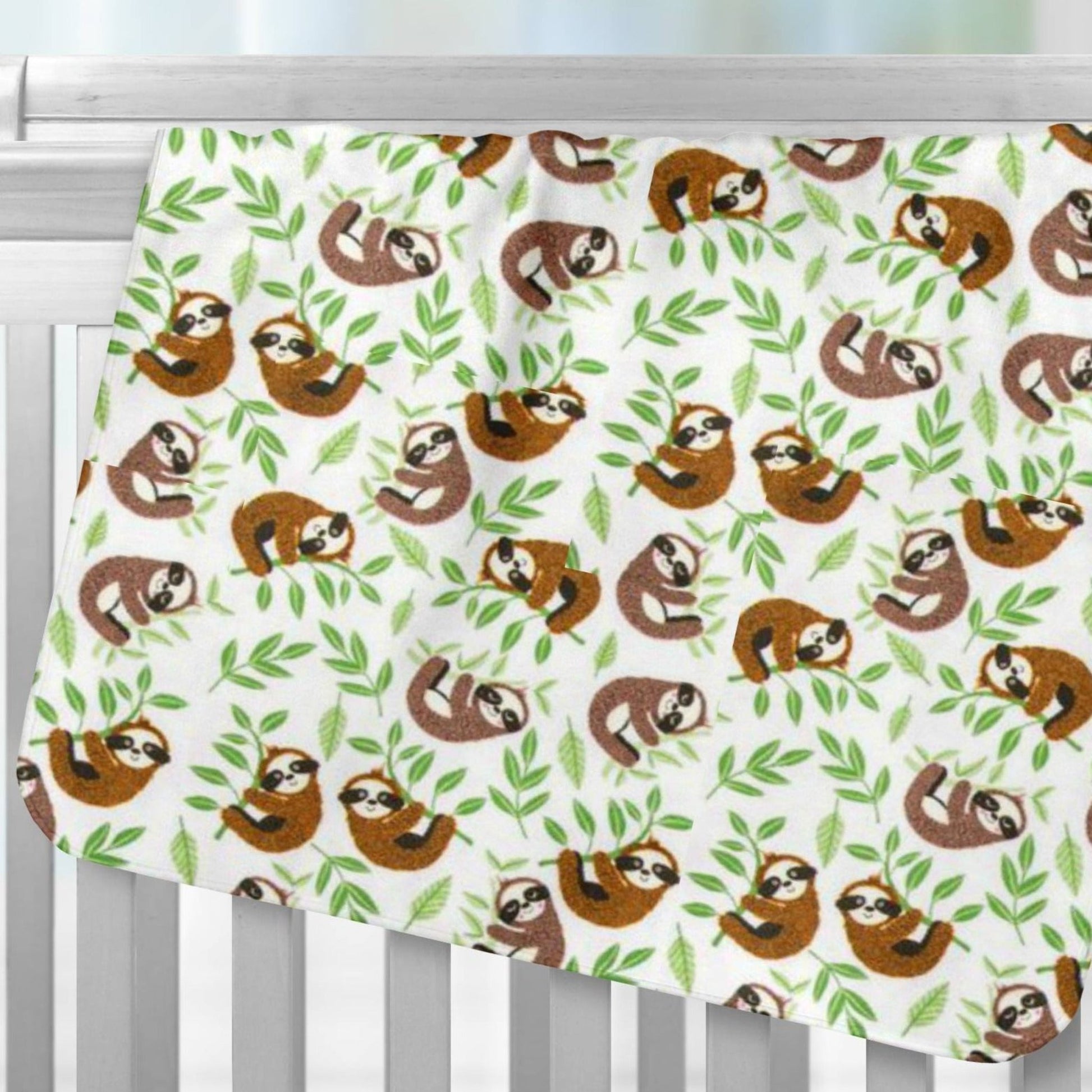 Baby Sloths Flannel Receiving Blanket Over Crib Rail