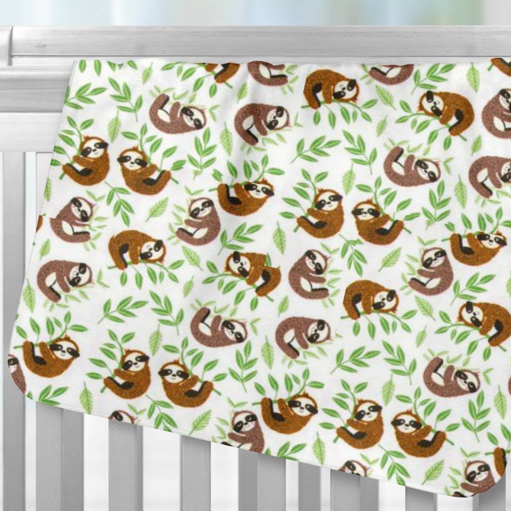 Baby Sloths Flannel Receiving Blanket Over Crib Rail