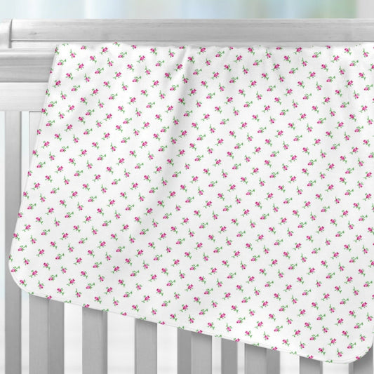 Tiny Pink Rosebuds Recieving Blanket over Crib Rails